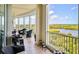 Peaceful screened balcony offering picturesque water views at 393 N Point Rd # 801, Osprey, FL 34229