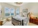 Comfortable guest bedroom with a queen-size bed and built-in shelving at 393 N Point Rd # 801, Osprey, FL 34229