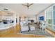 Open living area with hardwood floors, kitchen island, and comfy furniture at 393 N Point Rd # 801, Osprey, FL 34229