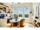 Bright home office with built-in shelving, large windows, and a spacious desk area at 393 N Point Rd # 801, Osprey, FL 34229