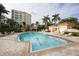 Community pool with plenty of lounge chairs and a surrounding patio at 393 N Point Rd # 801, Osprey, FL 34229