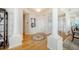 Elegant entryway with hardwood floors and columns at 393 N Point Rd # 801, Osprey, FL 34229