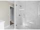 Bright bathroom with glass enclosed marble tiled shower and modern fixtures at 1012 Myrtle Ave, Venice, FL 34285