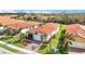 One-story home with terracotta tile roof in a community setting at 10141 Fiddlewood Dr, Venice, FL 34293