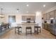 Island kitchen with granite countertops, stainless steel appliances, and stylish cabinetry at 10141 Fiddlewood Dr, Venice, FL 34293