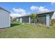 Landscaped backyard with screened porch and shed at 11213 Gulfstream Blvd, Port Charlotte, FL 33981