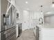 Modern kitchen with stainless steel appliances and white cabinetry at 11213 Gulfstream Blvd, Port Charlotte, FL 33981