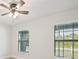 Bedroom with two windows and ceiling fan at 11213 Gulfstream Blvd, Port Charlotte, FL 33981