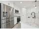 Modern kitchen with stainless steel appliances and white shaker cabinets at 11213 Gulfstream Blvd, Port Charlotte, FL 33981