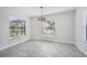 Breakfast nook with large windows and stylish light fixture at 11213 Gulfstream Blvd, Port Charlotte, FL 33981