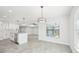 Bright dining area with view into the kitchen and living room at 11213 Gulfstream Blvd, Port Charlotte, FL 33981