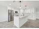 Modern kitchen with white shaker cabinets, granite countertops and stainless steel appliances at 11213 Gulfstream Blvd, Port Charlotte, FL 33981