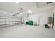 Two-car garage with epoxy floor and storage space at 11213 Gulfstream Blvd, Port Charlotte, FL 33981