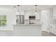Modern kitchen with white shaker cabinets, granite countertops and stainless steel appliances at 11213 Gulfstream Blvd, Port Charlotte, FL 33981