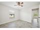 Well-lit bedroom with ceiling fan and tile floors at 11213 Gulfstream Blvd, Port Charlotte, FL 33981