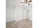 Bright bedroom with ceiling fan and double doors to closet at 11213 Gulfstream Blvd, Port Charlotte, FL 33981