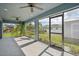 Spacious screened porch with ceiling fans and views of the backyard at 11213 Gulfstream Blvd, Port Charlotte, FL 33981