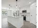 Open concept kitchen featuring a large island and stainless steel appliances at 11213 Gulfstream Blvd, Port Charlotte, FL 33981