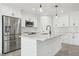 Modern kitchen with stainless steel appliances and white shaker cabinets at 11213 Gulfstream Blvd, Port Charlotte, FL 33981