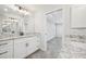 Elegant bathroom with double vanity, granite countertops, and an additional room at 11213 Gulfstream Blvd, Port Charlotte, FL 33981