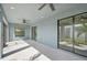 Relaxing screened porch with light blue walls and multiple sliding glass doors at 11213 Gulfstream Blvd, Port Charlotte, FL 33981