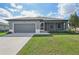 Single story home with gray exterior and screened porch at 11213 Gulfstream Blvd, Port Charlotte, FL 33981