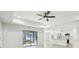 Open living room with high ceilings and a view of the kitchen at 11213 Gulfstream Blvd, Port Charlotte, FL 33981