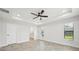Spacious main bedroom with ceiling fan and access to private bathroom at 11213 Gulfstream Blvd, Port Charlotte, FL 33981