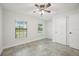 Bedroom with two windows, ceiling fan, and closet at 11213 Gulfstream Blvd, Port Charlotte, FL 33981