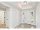 Bright and airy entryway with tile flooring and neutral color palette at 11213 Gulfstream Blvd, Port Charlotte, FL 33981