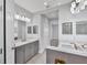 Double vanity bathroom with modern fixtures at 14611 Barefoot Ln, Parrish, FL 34219