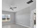Spacious bedroom with ceiling fan and window at 14611 Barefoot Ln, Parrish, FL 34219