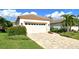 Single-story house with a two-car garage and a well-manicured lawn at 3924 Alamanda Dr, Sarasota, FL 34238