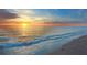 Scenic ocean sunset with tranquil waves, showcasing the beauty of the beach at golden hour at 577 Venice Ln, Sarasota, FL 34242