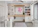 Charming home office featuring custom built-ins, wood desktop, and unique modern decor at 577 Venice Ln, Sarasota, FL 34242
