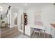 Bright office with a modern desk, chair, home decor, and view into hallway and wine cellar at 577 Venice Ln, Sarasota, FL 34242