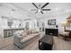 Open-concept living room featuring a modern kitchen, comfortable seating, and a stylish coffee table at 577 Venice Ln, Sarasota, FL 34242