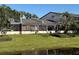 Backyard view of screened in porch and water feature at 7234 Cloister Dr # 7234, Sarasota, FL 34231