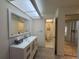 Bright bathroom featuring a vanity with a large mirror, and tiled floors at 7234 Cloister Dr # 7234, Sarasota, FL 34231
