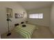 Cozy bedroom with modern decor, neutral carpet, and a large window at 7234 Cloister Dr # 7234, Sarasota, FL 34231