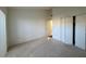 Spacious bedroom featuring ample closet space and neutral carpet flooring at 7234 Cloister Dr # 7234, Sarasota, FL 34231