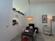 Dining room with view into kitchen and light fixture at 7234 Cloister Dr # 7234, Sarasota, FL 34231