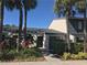 Condo featuring mature landscaping and a shady walkway to the front door at 7234 Cloister Dr # 7234, Sarasota, FL 34231