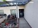 Inviting front porch with seating, a decorative wreath, and a well-lit entrance at 7234 Cloister Dr # 7234, Sarasota, FL 34231