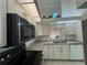 Kitchen showcasing granite countertops, modern appliances, and plenty of natural light at 7234 Cloister Dr # 7234, Sarasota, FL 34231