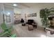 Spacious living room with high ceilings, skylights, and comfortable seating arrangements at 7234 Cloister Dr # 7234, Sarasota, FL 34231