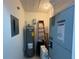 Utility room featuring essential systems and a ladder at 7234 Cloister Dr # 7234, Sarasota, FL 34231