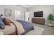 Main bedroom with ensuite bathroom and wood dresser at 2630 Beeville Ave, North Port, FL 34286