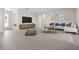 Spacious living room with comfortable seating and large TV at 2630 Beeville Ave, North Port, FL 34286