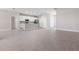 Open concept kitchen with white cabinets and stainless steel appliances at 2630 Beeville Ave, North Port, FL 34286